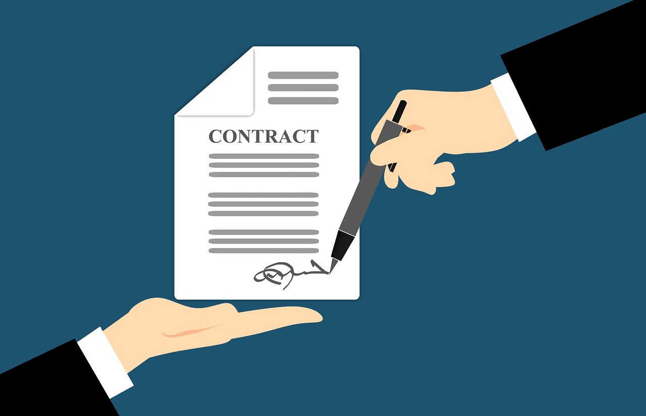 shaking hands over a contract
