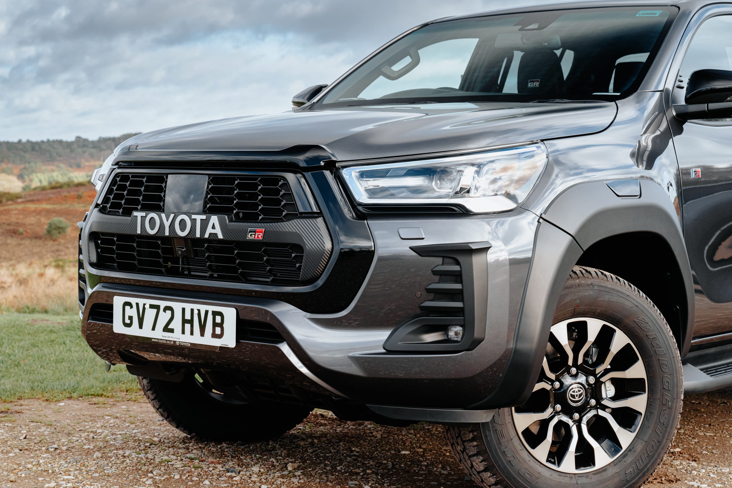 Toyota Hilux front end grille and wheels parked